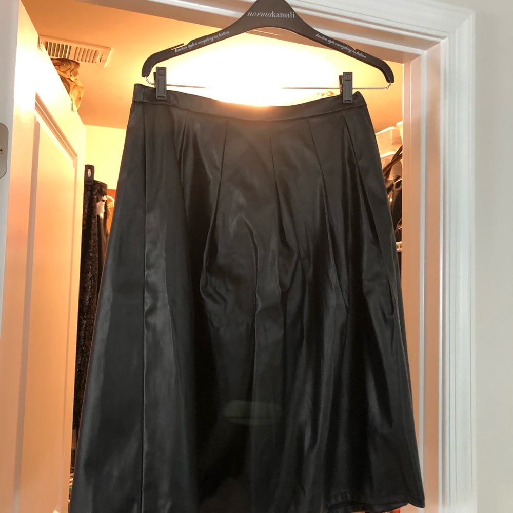 Black leather like pleated knee length skirt